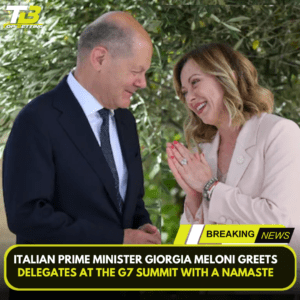 Italian Prime Minister Giorgia Meloni greets delegates at the G7 summit with a namaste